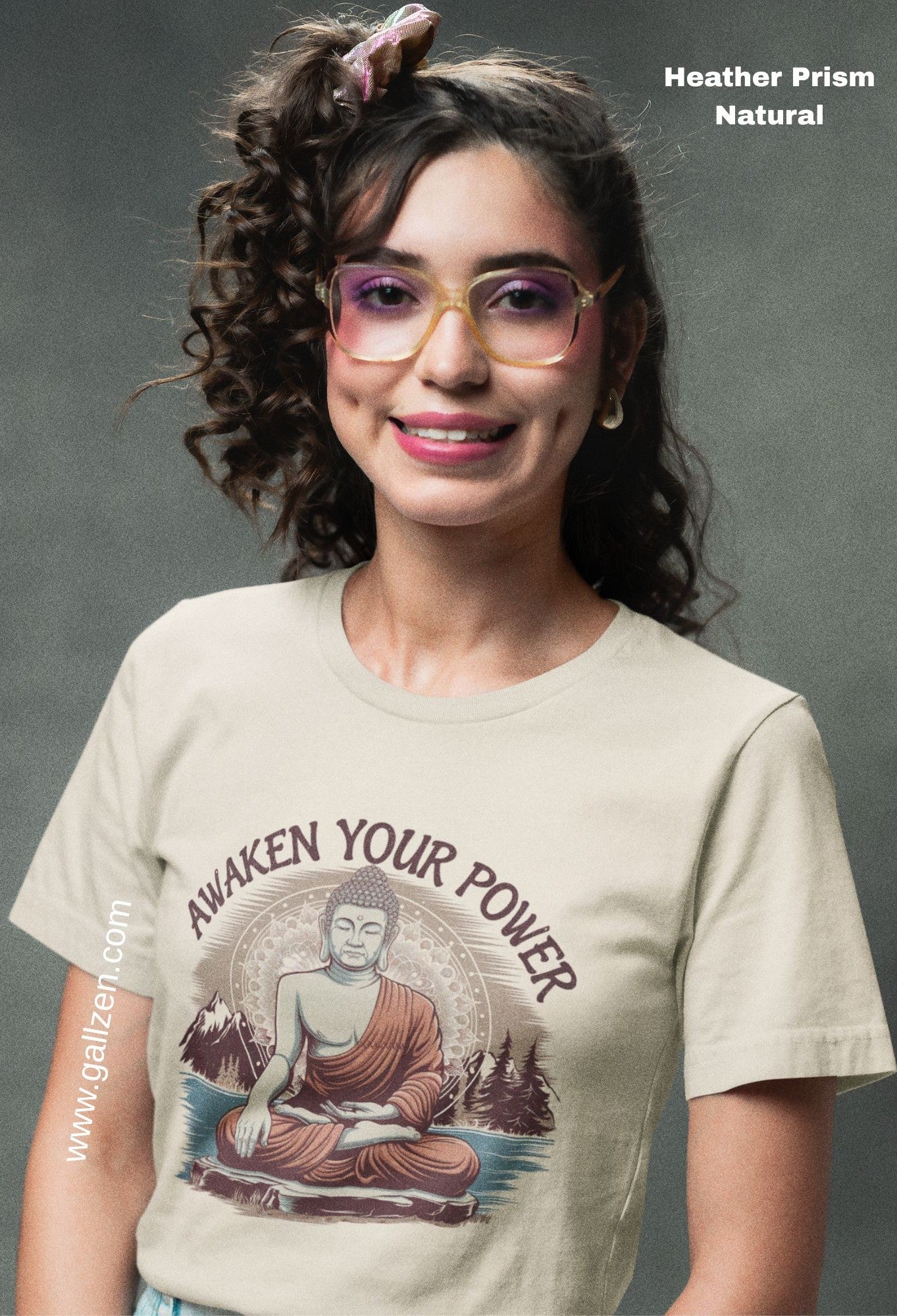 A smiling woman wearing a t-shirt with a serene, meditative design, reflecting a sense of tranquility and inner peace.