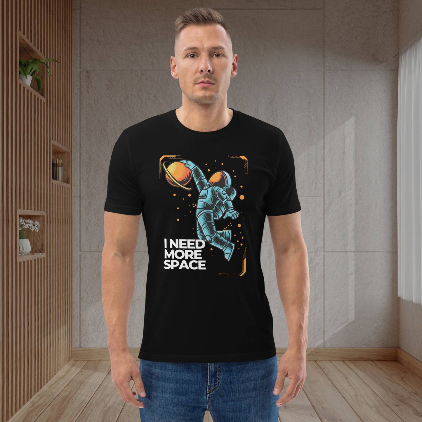 Astronaut-themed-black-t-shirt-worn-by-a-jovial-30-year-old-man-in-a-cozy-living-room