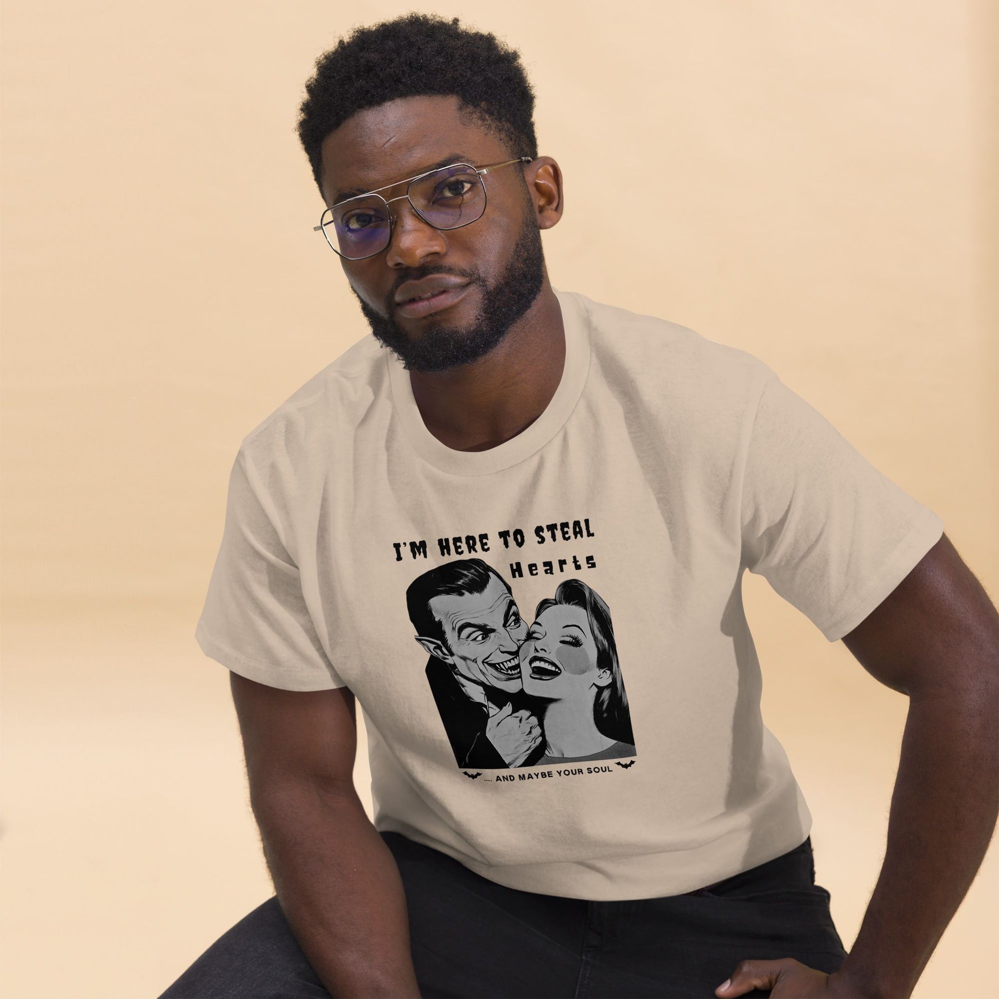 Cheerful-African-American-man-wearing-a-Halloween-inspired-t-shirt-with-a-vintage-horror-film-illustration-in-beige