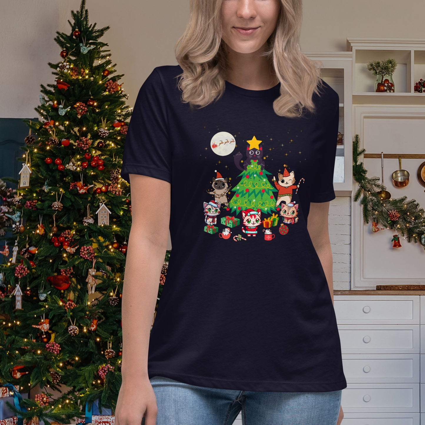 Cheerful-woman-in-a-navy-blue-t-shirt-decorated-with-a-festive-and-colorful-Christmas-tree-and-cute-cats-graphic