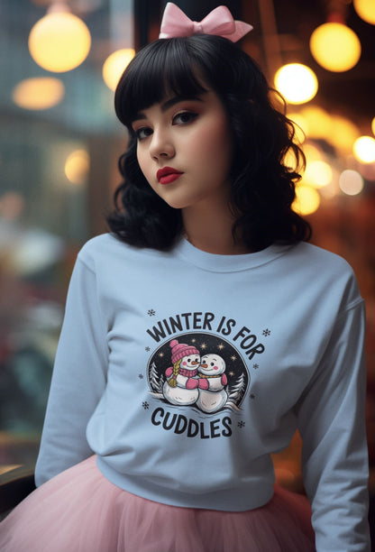 Christmas-inspired-cozy-sweatshirt-with-snowmen-illustration-worn-by-a-young-woman-with-retro-styled-makeup-and-a-pink-hair-bow