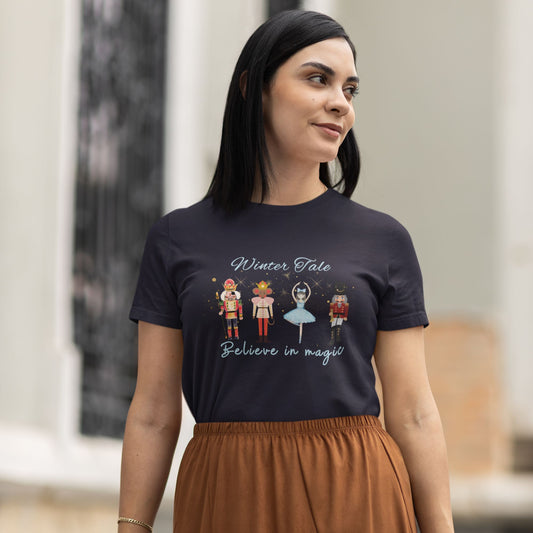 Close-up-of-a-stylish-navy-t-shirt-on-a-woman-decorated-with-colorful-Nutcracker-and-ballerina-illustrations-paired-with-a-brown-skirt