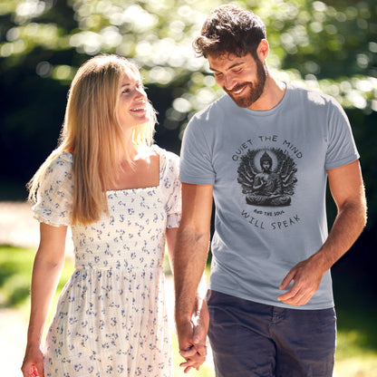 Couple-walking-outdoors-the-man-wearing-a-dark-blue-t-shirt-with-a-meditating-Buddha-design-and-the-words-Quiet-the-mind-and-the-soul-will-speak