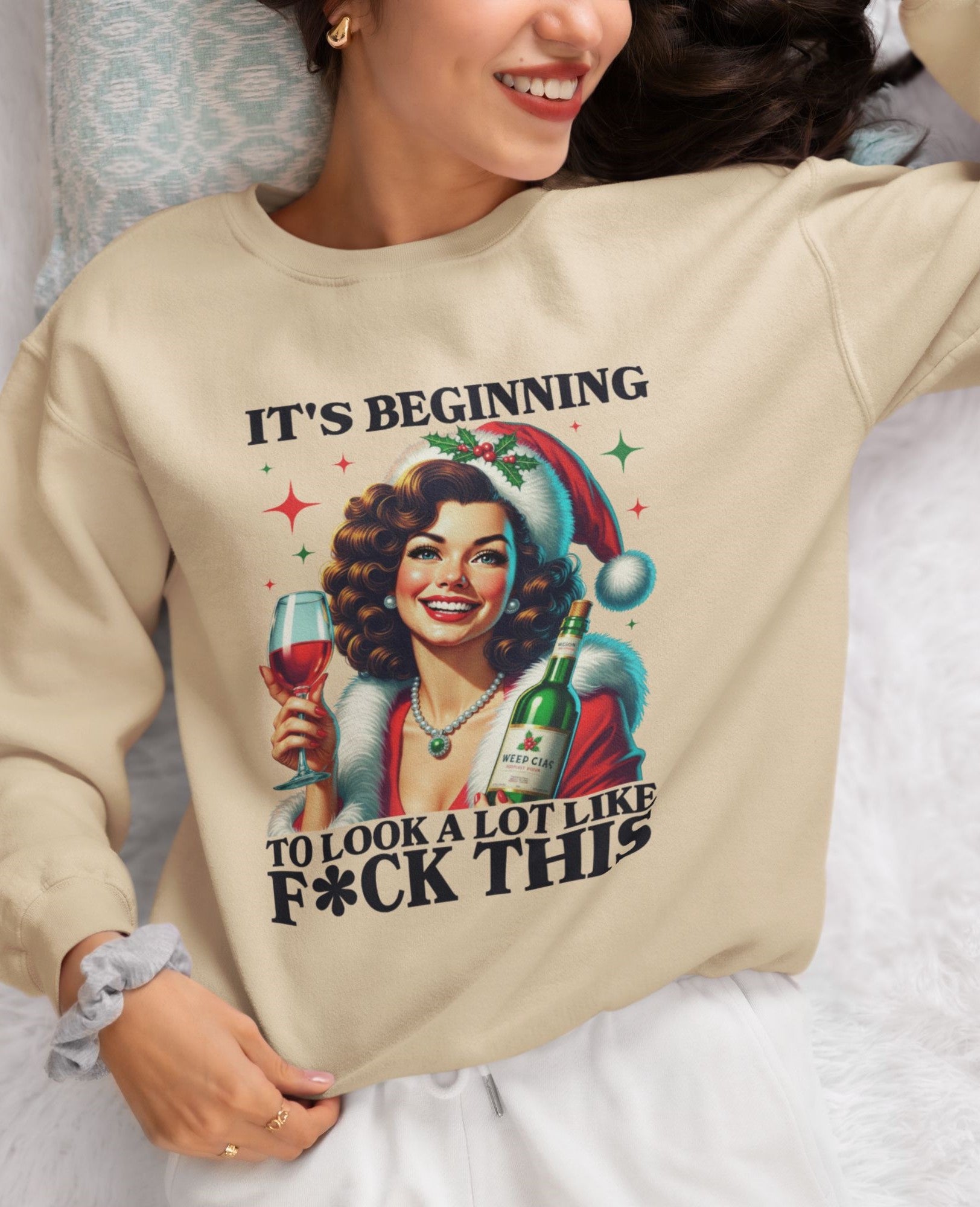 Cozy-Christmas-sweatshirt-with-a-vintage-holiday-design-and-bold-lettering-worn-by-a-woman-smiling-on-a-bed