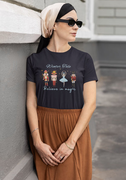 Elegant-woman-in-a-navy-tee-displaying-a-charming-Winter-Tale-Nutcracker-graphic-blending-traditional-and-modern-styles