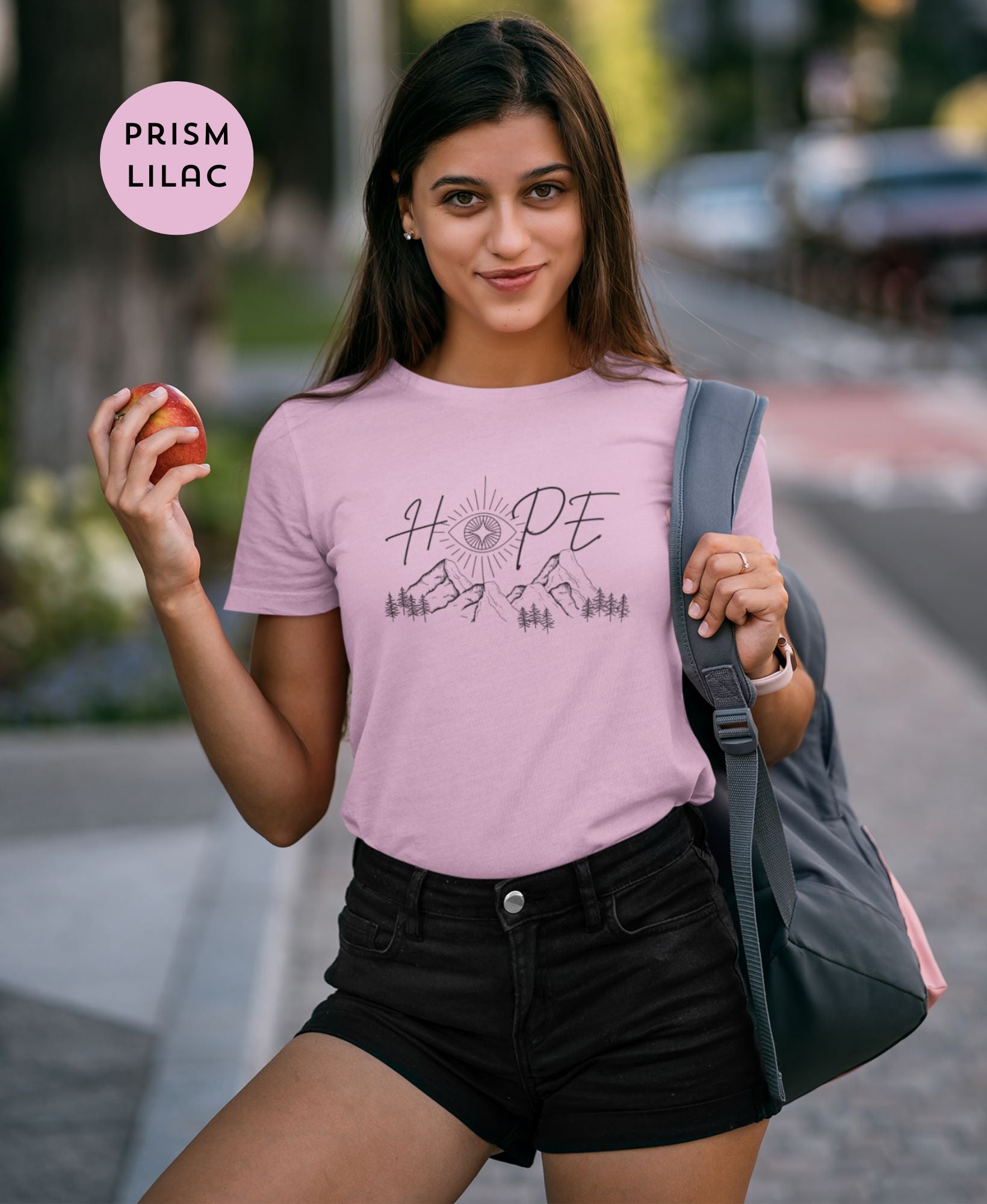 Flirty-city-pose-by-young-lady-in-Prism-Lilac-t-shirt-and-high-waisted-shorts