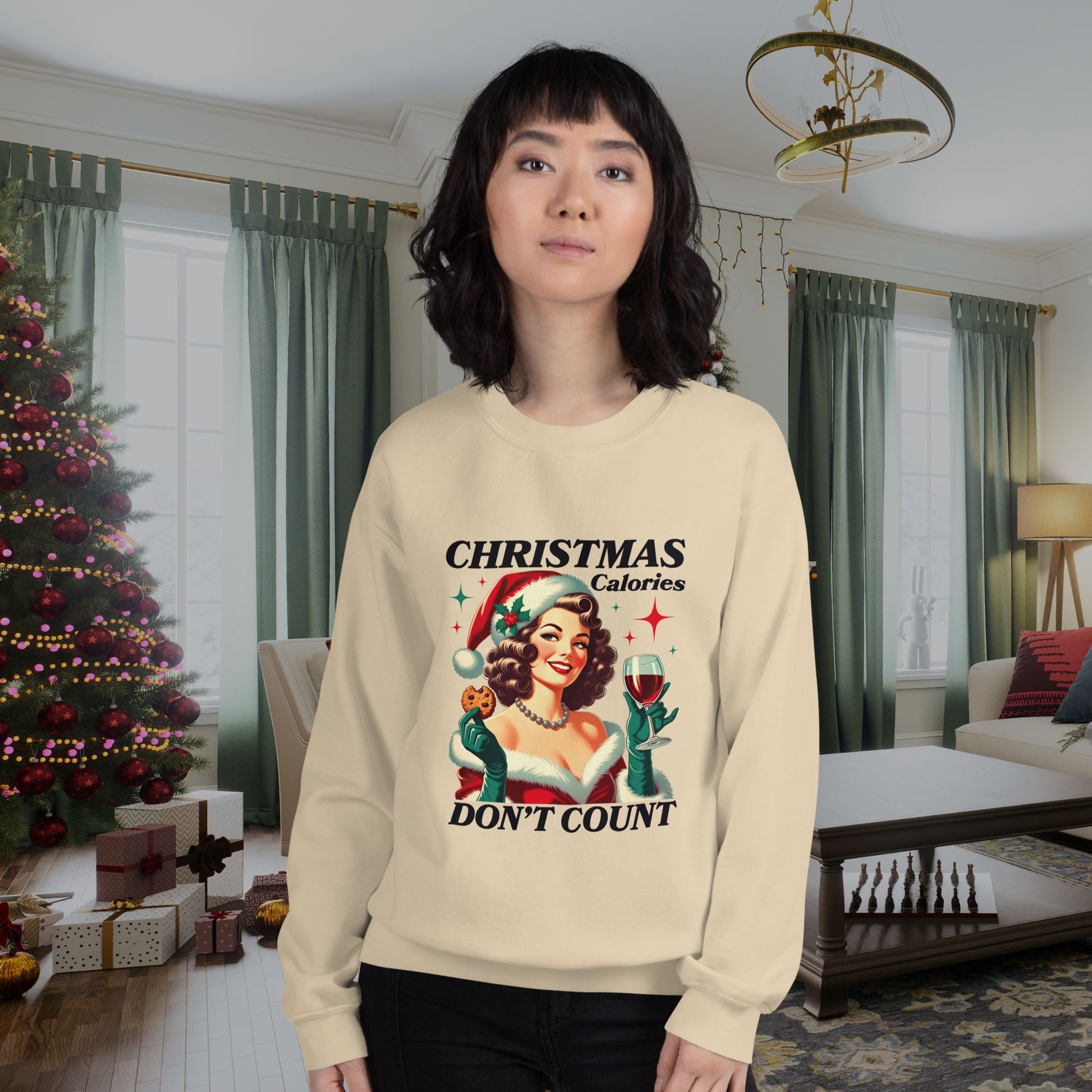 Holiday-themed-sweatshirt-featuring-retro-style-artwork-worn-by-a-young-woman-in-a-warmly-lit-Christmas-decorated-room