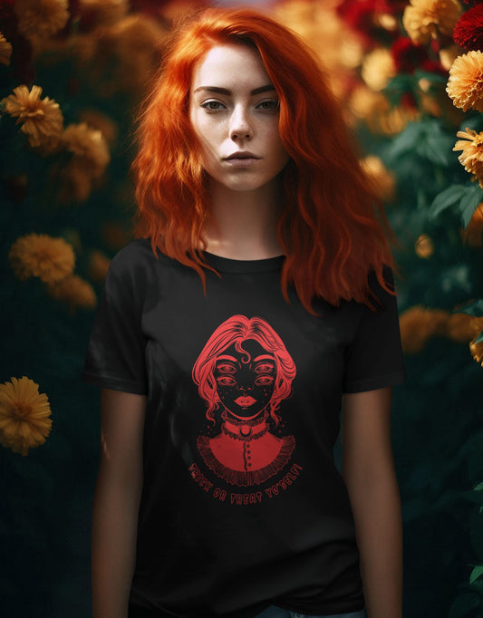 Nature-themed-photo-of-a-redhead-young-woman-wearing-a-Halloween-graphic-t-shirt-in-a-garden-setting