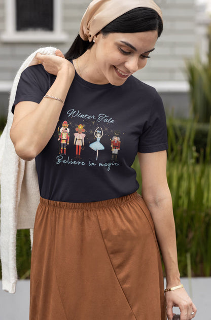 Navy-t-shirt-featuring-a-festive-Nutcracker-theme-with-a-motivational-quote-worn-by-a-woman-in-a-casual-chic-outfit