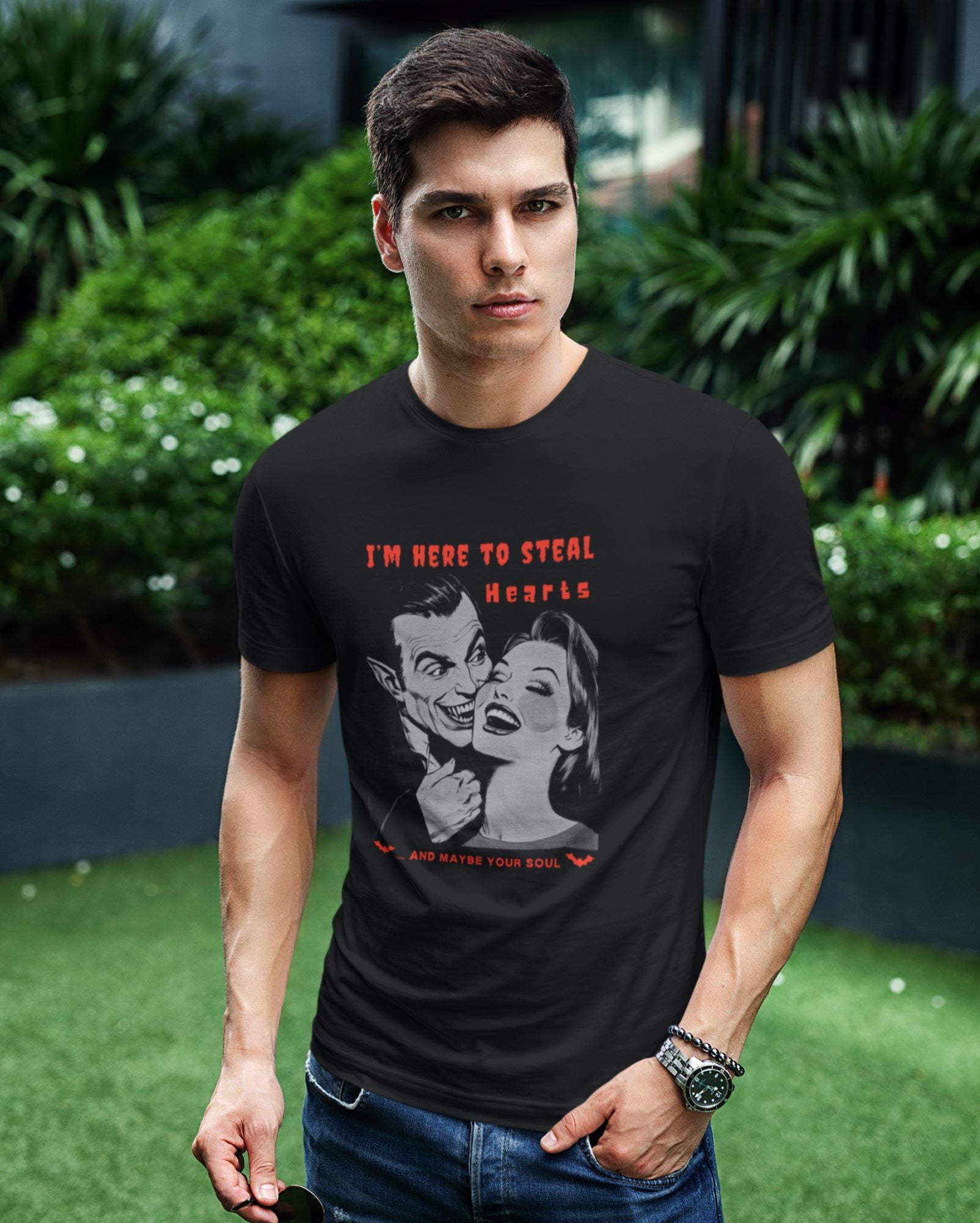 Portrait-of-a-young-man-showcasing-a-black-Halloween-t-shirt-with-vampire-artwork