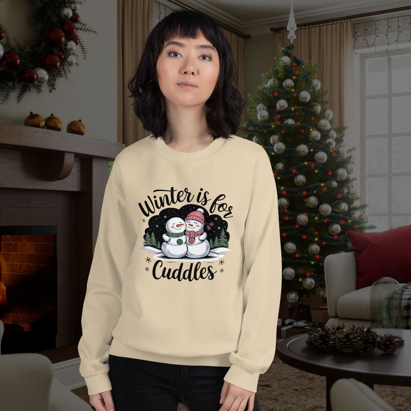 Winter-themed-sweatshirt-worn-by-a-model-standing-in-a-cozy-decorated-room-with-a-Christmas-tree-and-holiday-decor