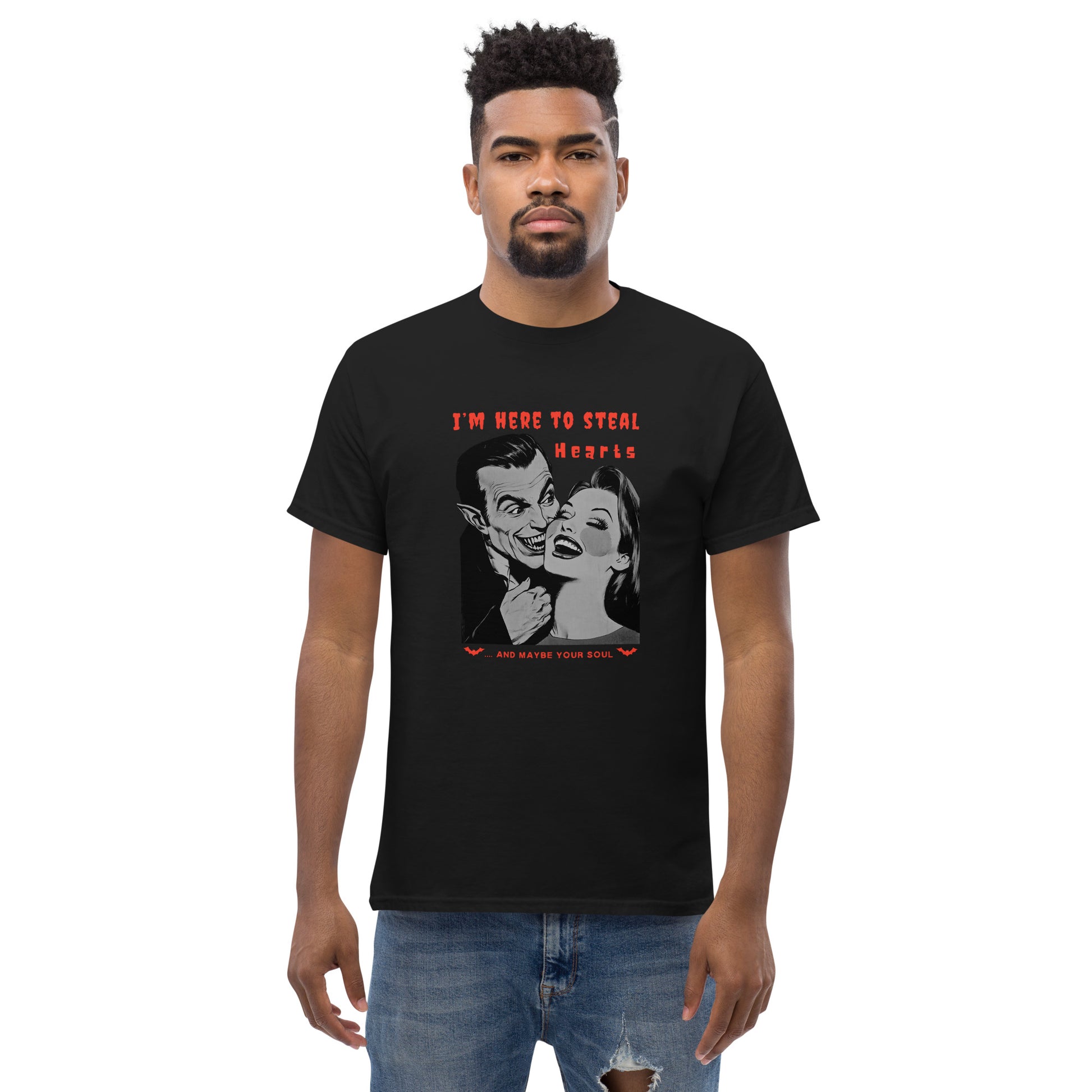 Young-bearded-man-with-afro-hair-in-a-black-Halloween-t-shirt-with-a-vintage-vampire-and-woman-illustration