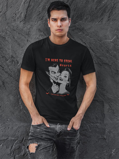 Young-man-against-a-gray-textured-wall-wearing-a-black-t-shirt-with-a-vintage-vampire-print-for-Halloween