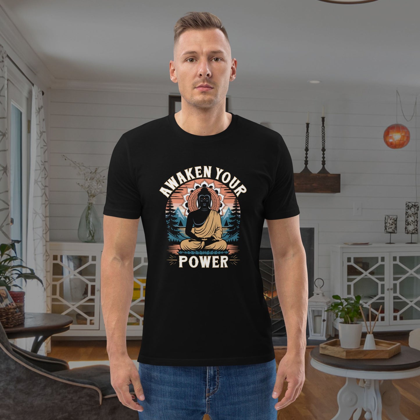 Man wearing a black t-shirt with a Buddha graphic and text in a living room.