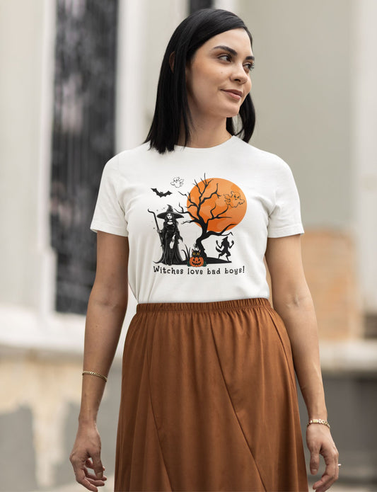 attractive-brunette-woman-poses-on-a-white-tee-with-Halloween-inspired-witch-and-pumpkin-design