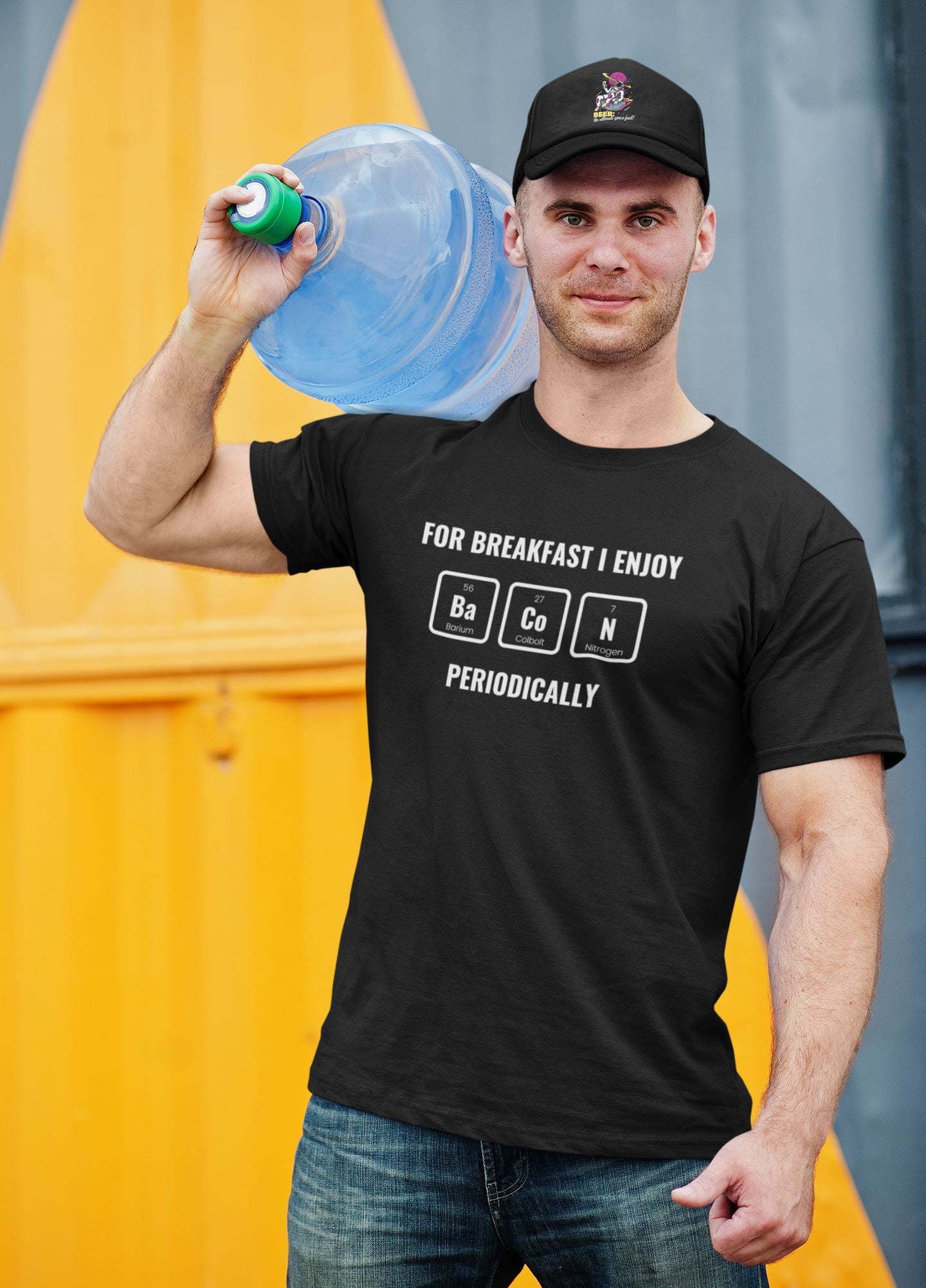 black-eco-t-shirt-with-funny-breakfast-graphic-and-cool-hat-mockup-featuring-a-man-delivering-water