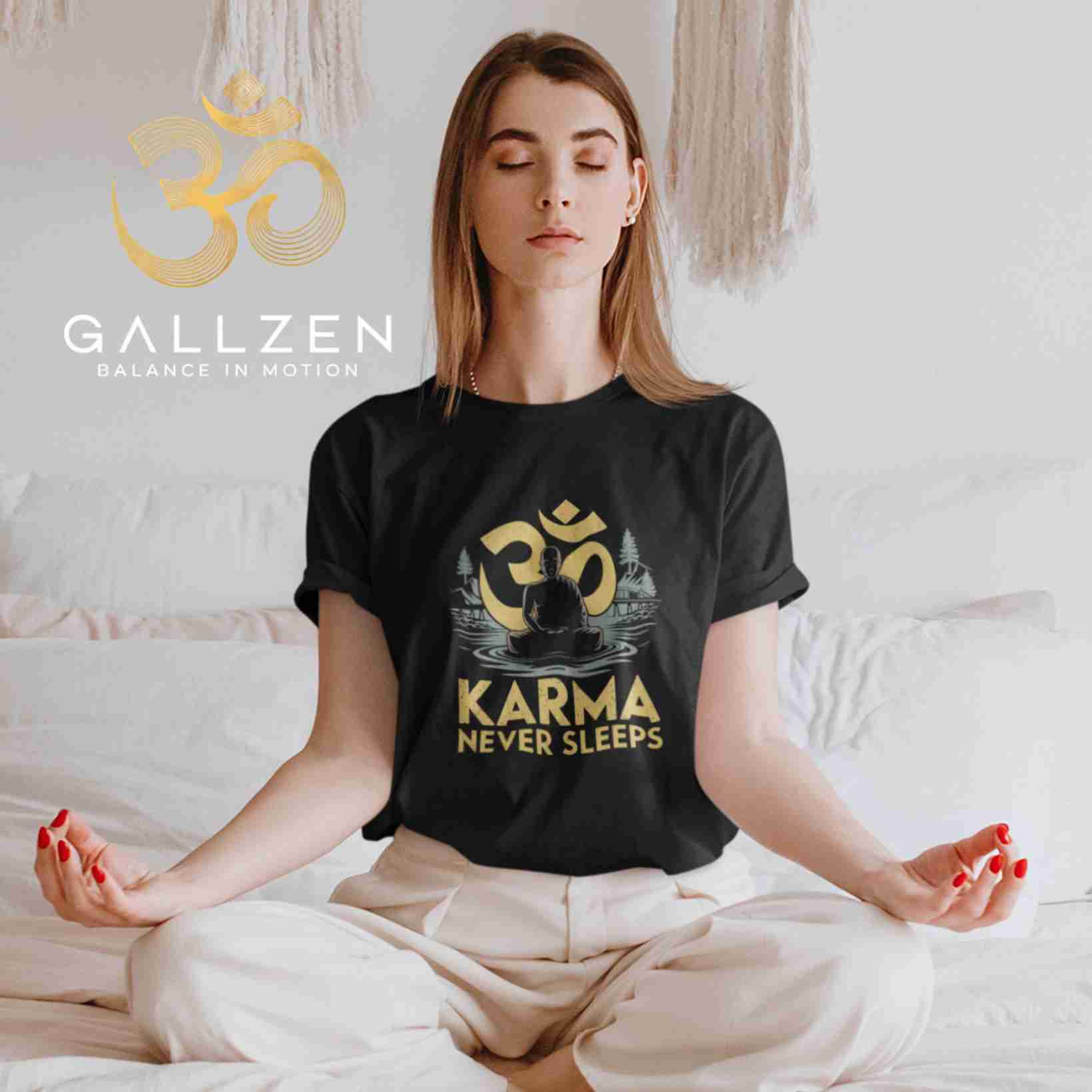 Woman meditating in a lotus pose on a bed while wearing a black spiritual t-shirt with a gold Om design