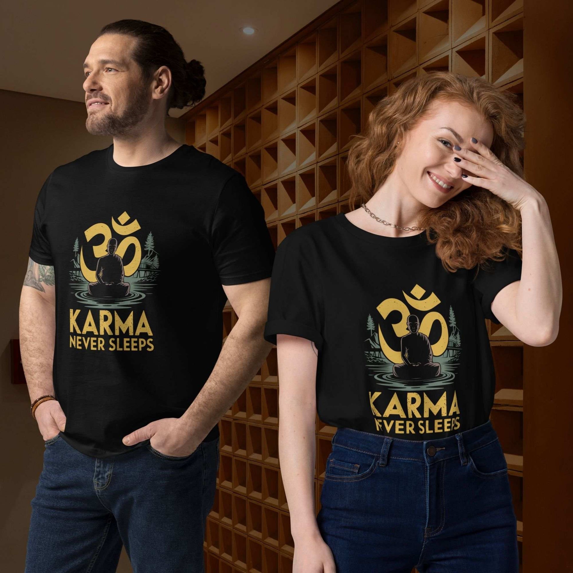 Man and woman posing side-by-side indoors against a textured wall while wearing the black karma never sleeps t-shirt