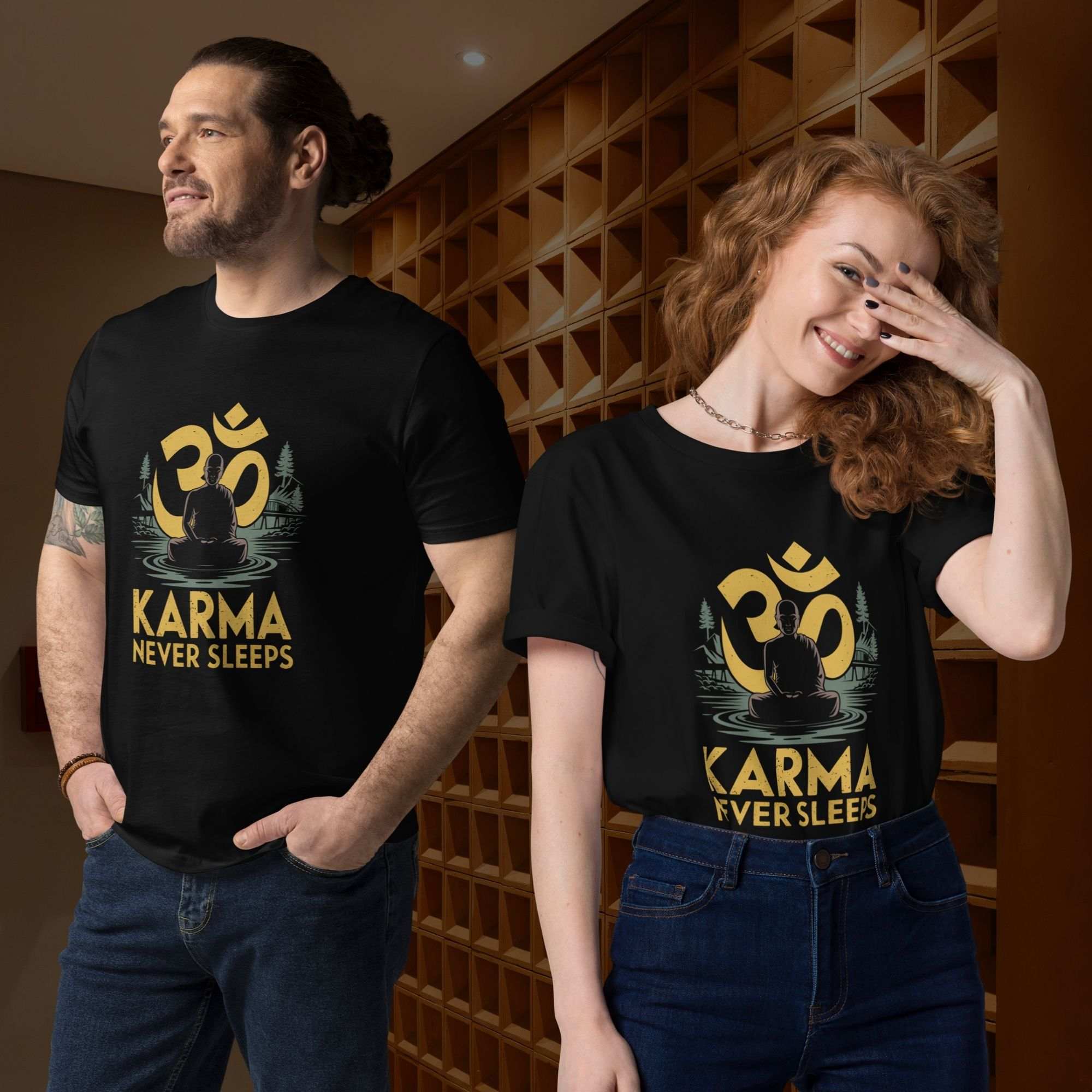 Man and woman posing side-by-side indoors against a textured wall while wearing the black karma never sleeps t-shirt