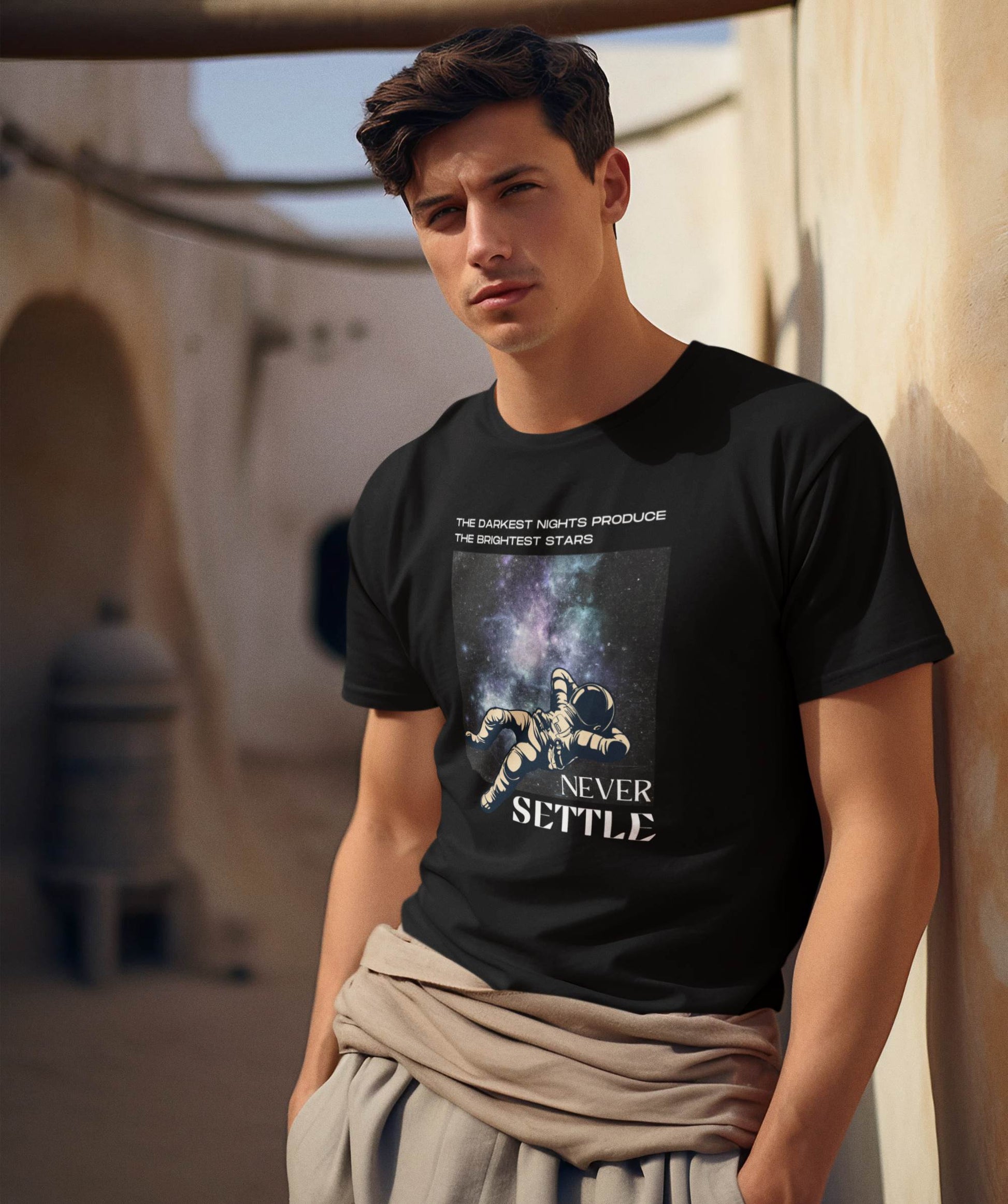 man-posing-on-a-tatooine-inspired-by-star-wars-wearing-a-motivational-t-shirt-designed-with-a-tag-line-never-settl