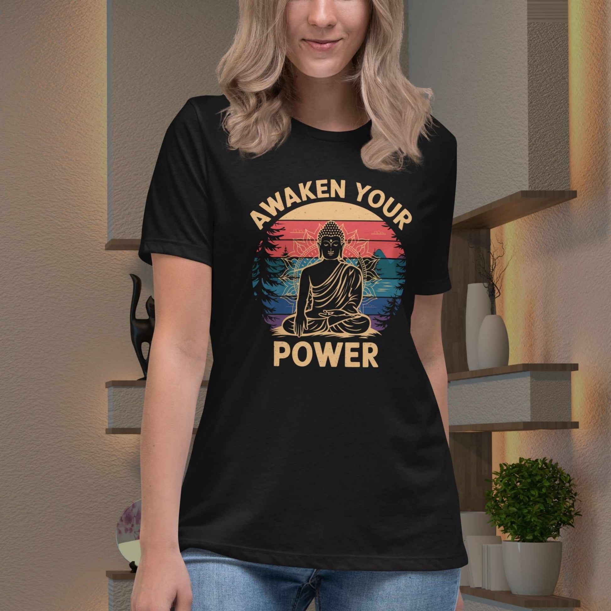 Person wearing a black t-shirt with 'Awaken Your Power' design in a room.