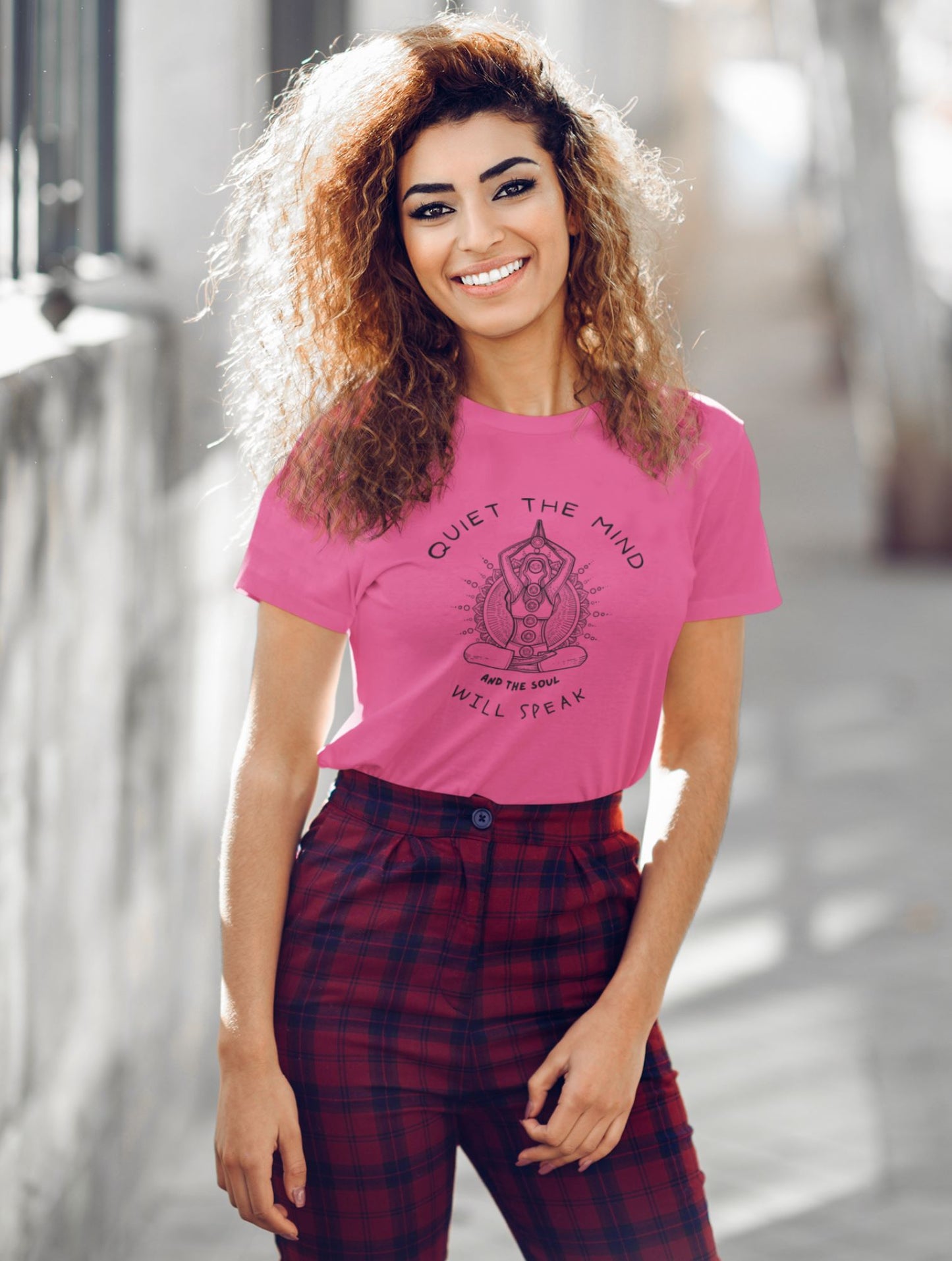 mockup-of-a-smiling-young-woman-wearing-a-t-shirt-on-the-street-with-a-yoga-themed-design-and-the-phrase-quiet-the-mind