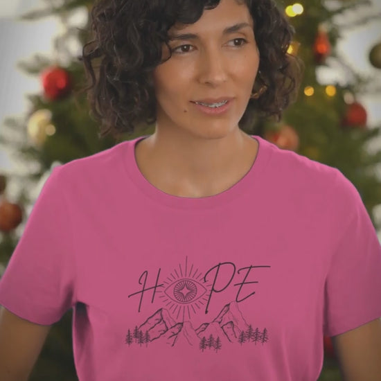 Round-Neck-Berry-Tee-Video-Featuring-A-Smiling-Woman-Posing-Against-A-Christmas-Tree