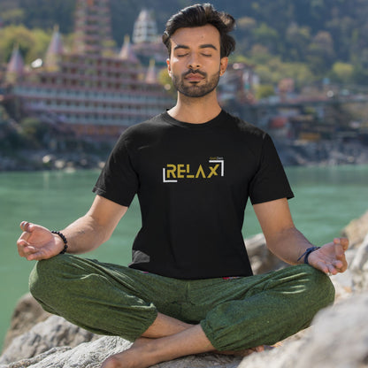 relax-black-tee-mockup-of-a-young-man-in-a-meditating-near-the-seaside-on-the-Sicilian-coast