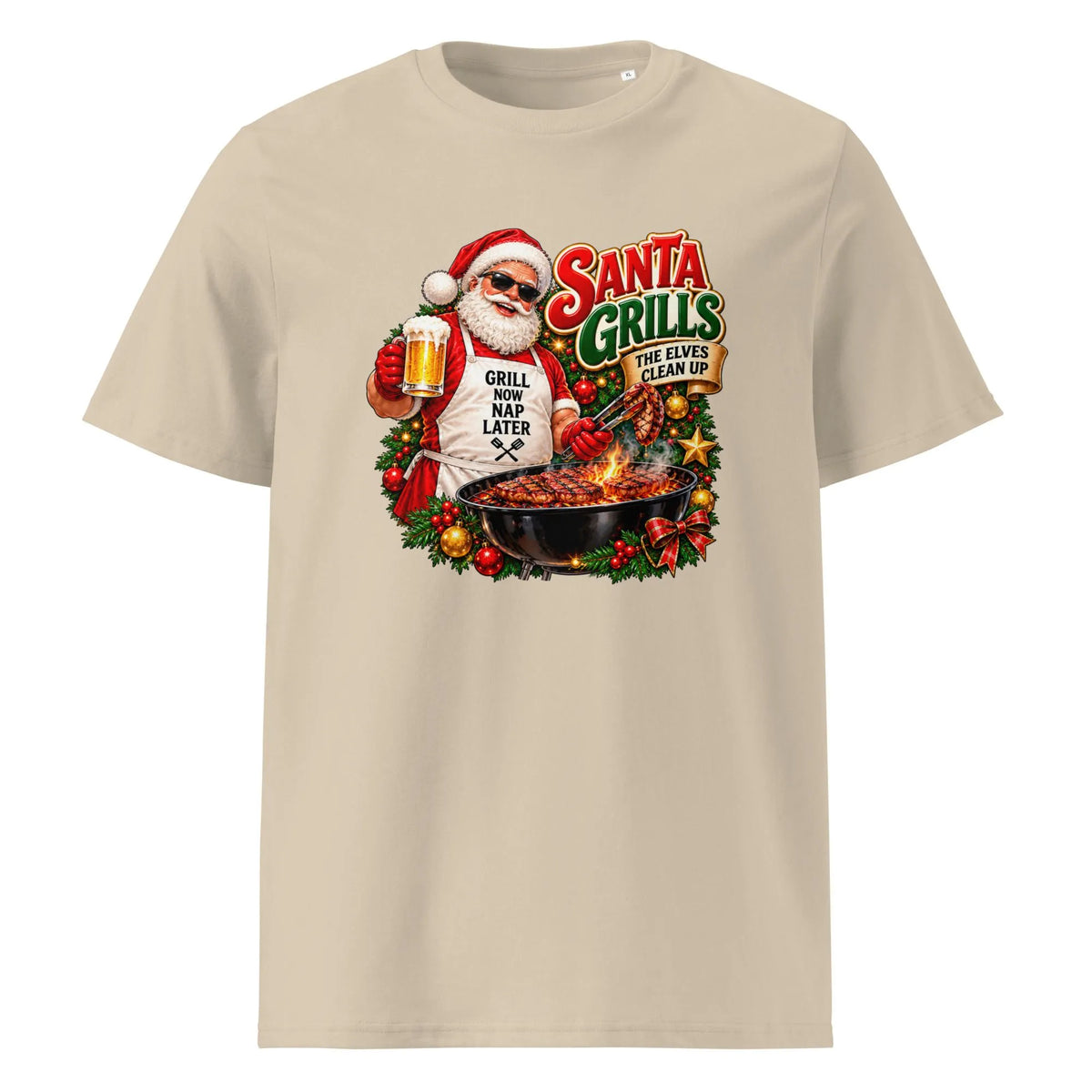 Front view of a beige Santa grilling Christmas shirt featuring Santa holding a beer and barbecue tongs, with the slogan “Santa Grills, the Elves Clean Up.”