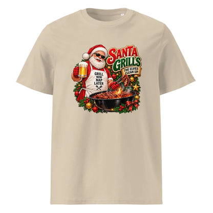 Front view of a beige Santa grilling Christmas shirt featuring Santa holding a beer and barbecue tongs, with the slogan “Santa Grills, the Elves Clean Up.”