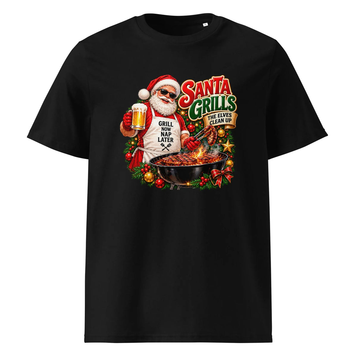 A black short-sleeve crewneck t-shirt featuring a colorful graphic of Santa Claus wearing sunglasses and a 'Grill Nap Later' shirt while holding a beer mug next to a grill. The text 'Santa Grills' is written above the grill.