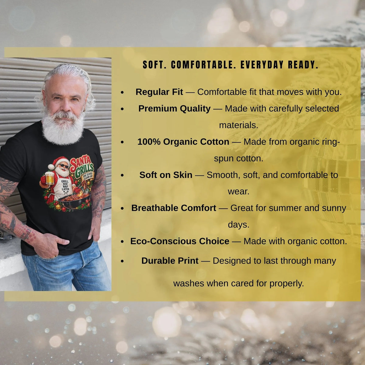 Bearded man wearing a black Santa Christmas shirt beside text highlighting regular fit, 100% organic ring-spun cotton, softness, breathability, and print durability with proper care.