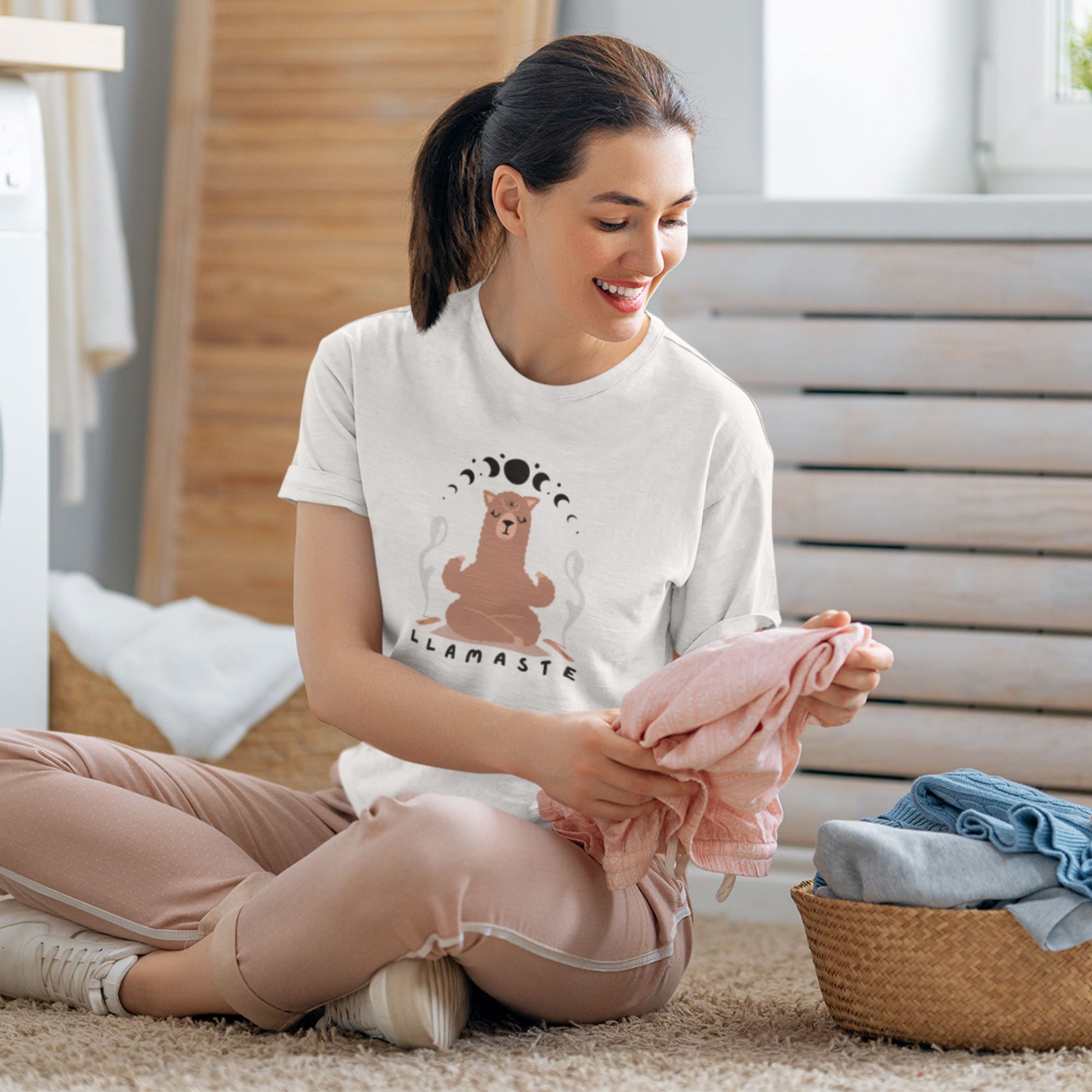 t-shirt-mockup-of-a-woman-smiling-while-doing-laundry-for-her-kids