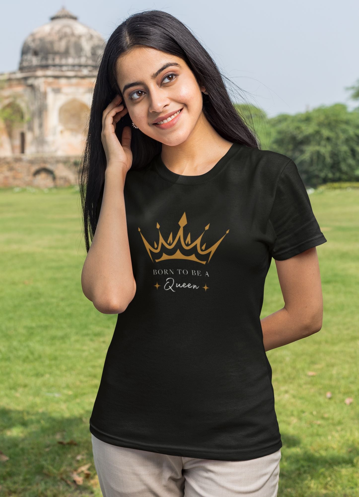 t-shirt-mockup-of-a-young-woman-posing-in-front-of-an-old-indian-temple