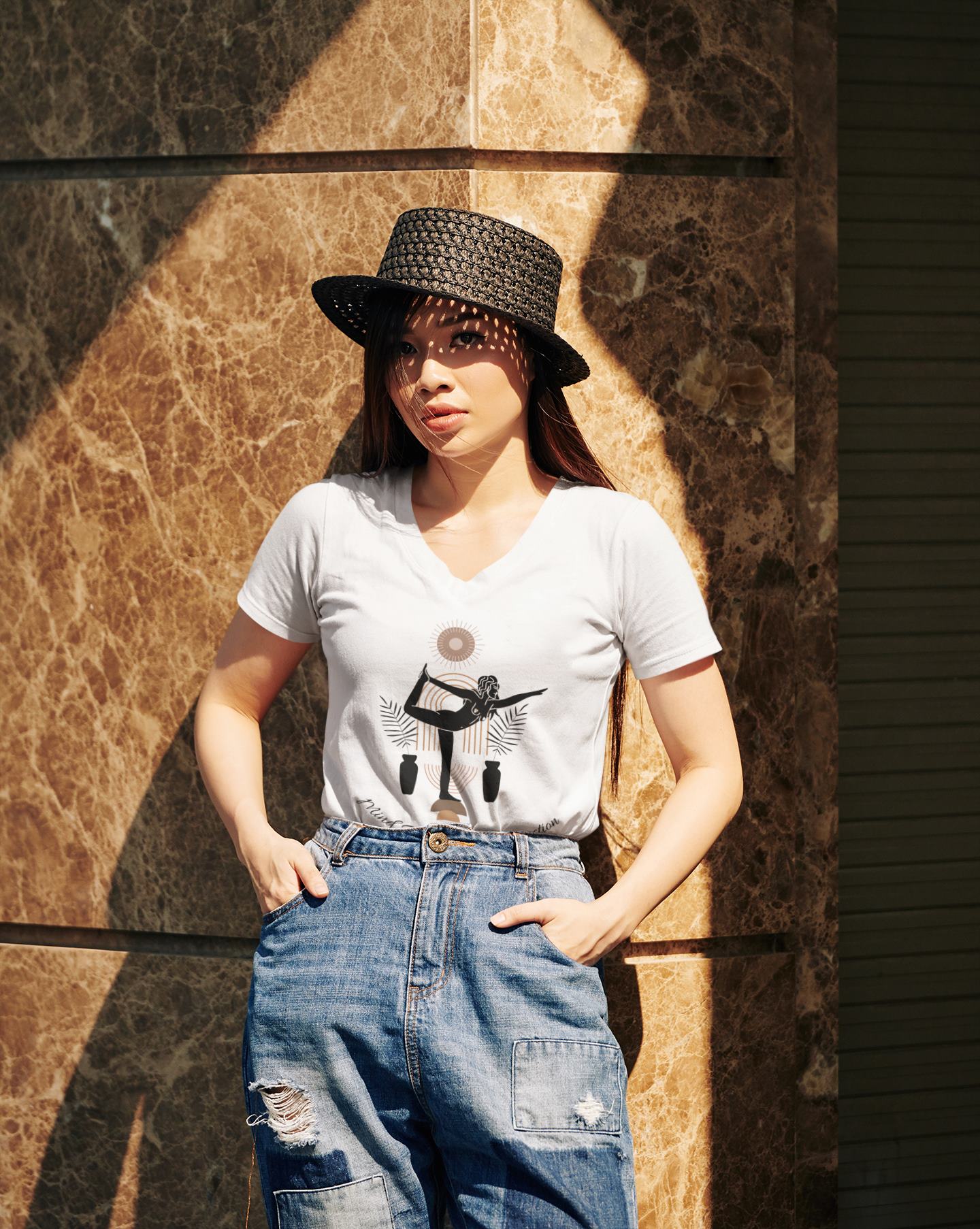 v-neck-t-shirt-mockup-of-a-fashionable-woman-posing-next-to-the-wall-of-a-mall-in-the-city-center