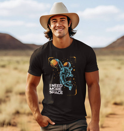 western-man-wearing-a-cowboy-hat-and-a-humorous-black-t-shirt-showcasing-a-blue-astronaut-floating-in-the-cosmos