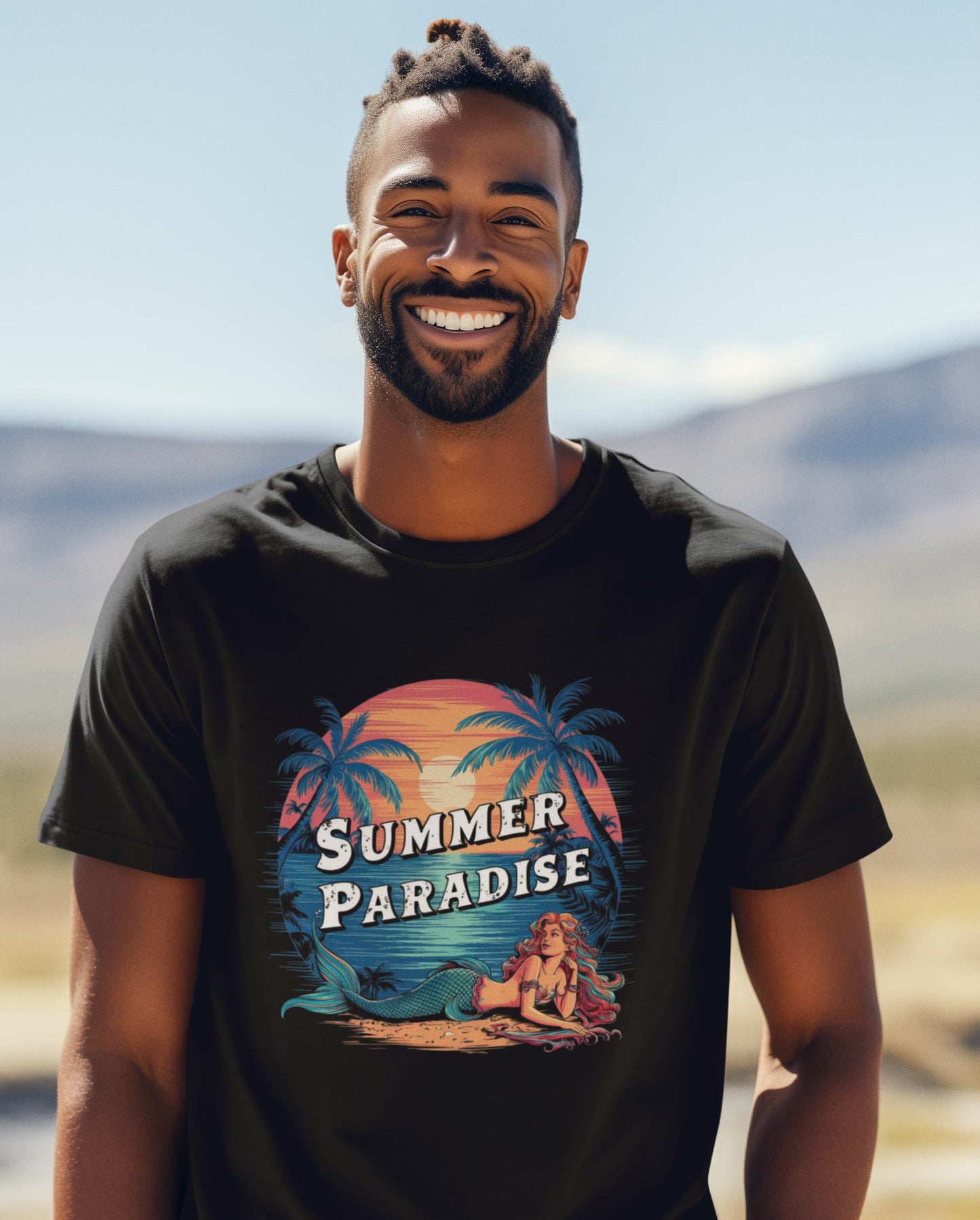 young-man-wears-a-black-t-shirt-with-a-summer-paradise-print-featuring-a-summer-sunset-and-a-mermaid-resting-on-the-beach